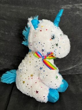 Plush White Unicorn Stuffed Animal with Blue Accents and Rainbow Bow